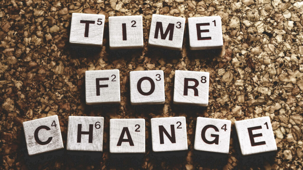 Scrabble Tile Motivational Wallpaper: TIME FOR CHANGE on Corkboard
