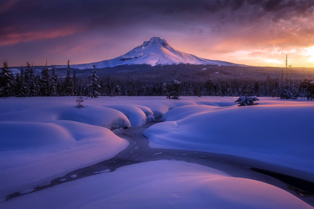 Mount Hood snow mountain with icy stream vibrant purple gold sunset peaceful winter landscape background Wallpaper