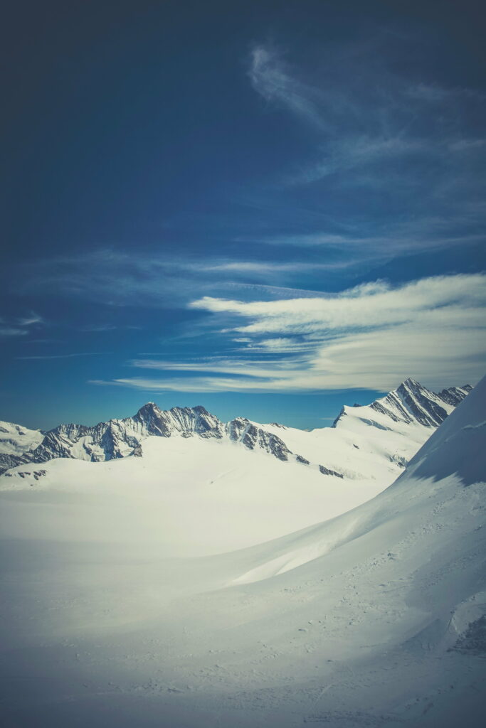 Winter Wonderland: Majestic Snow-Capped Mountains - A Mesmerizing HD Phone Wallpaper