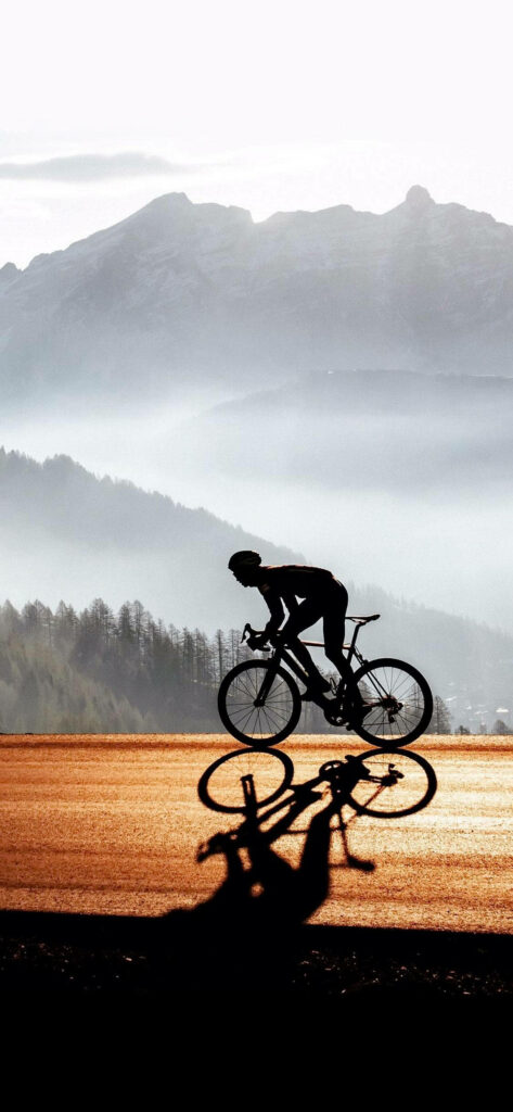 Riding Into New Heights: Jaw-Dropping Views and Cycling Glory Wallpaper