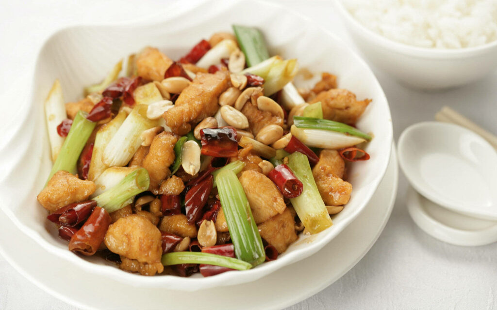 Spicy Stir-Fried Chicken 4K Wallpaper: Delicious Bowl of Flavor