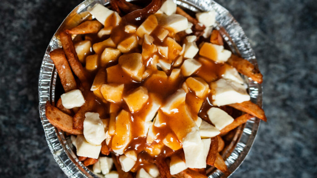 Classic Canadian Poutine Wallpaper: Crispy Fries & Cheese Curds