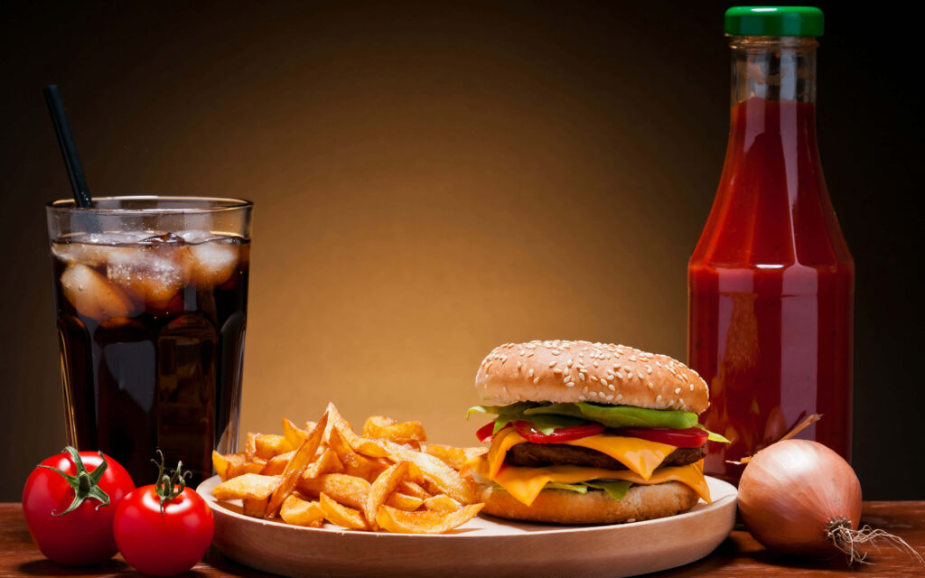 Delicious Cheeseburger & Fries Wallpaper Background with Iced Cola