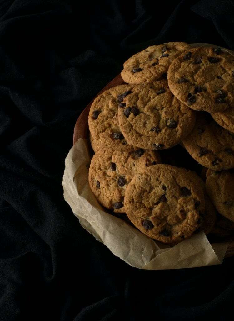 Mouthwatering Chocolate Chip Cookie Wallpaper on Dark Background