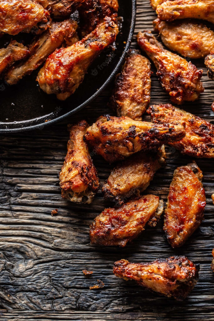 Mouthwatering Crispy Chicken Wings Wallpaper - Rustic Table Delight