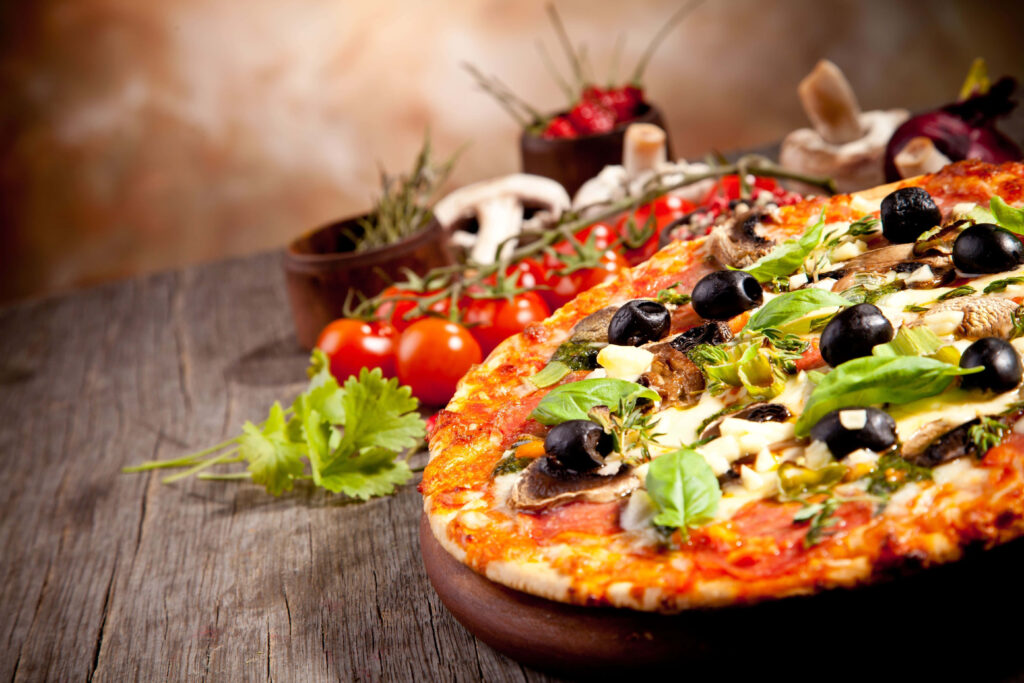 Mouthwatering Italian Pizza: Basil, Olives & Mushrooms Wallpaper