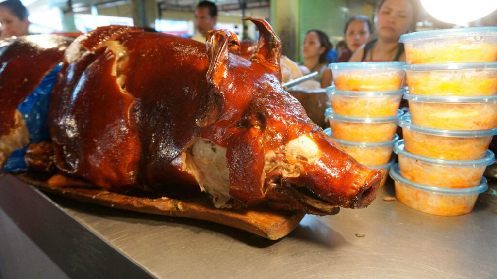 Succulent Lechon and Fresh Sides: Bustling Market Wallpaper