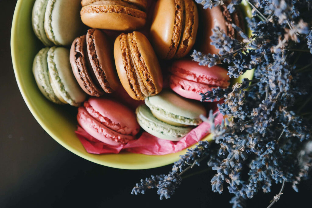 Delicate Macarons and Blossoming Lavender: A Captivating Flat Lay Composition Wallpaper