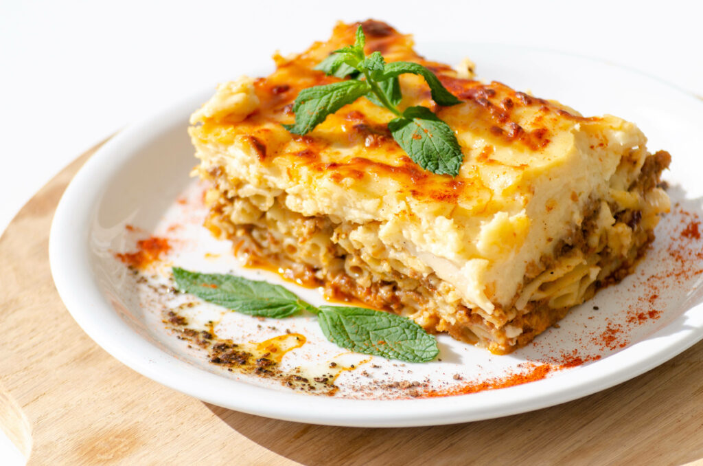 Mouthwatering Moussaka Wallpaper: Delectable Slice on White Plate