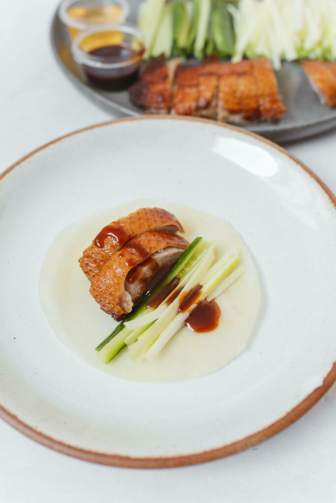 Delectable Peking Duck Wallpaper: Mouthwatering Feast Background