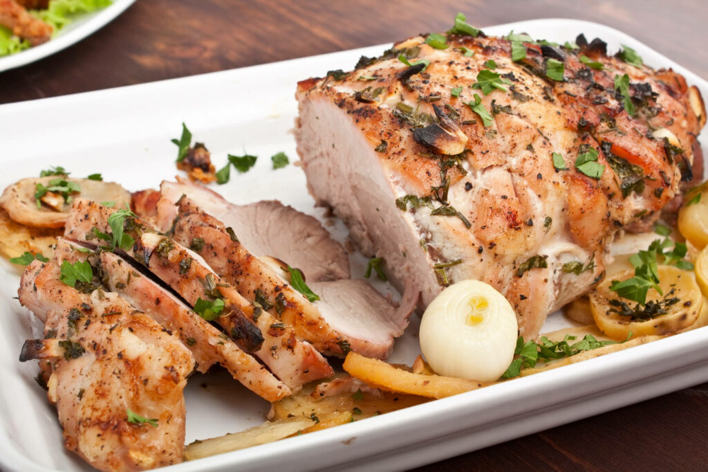 Delicious Roasted Pork Ribs Wallpaper with Garlic & Herbs