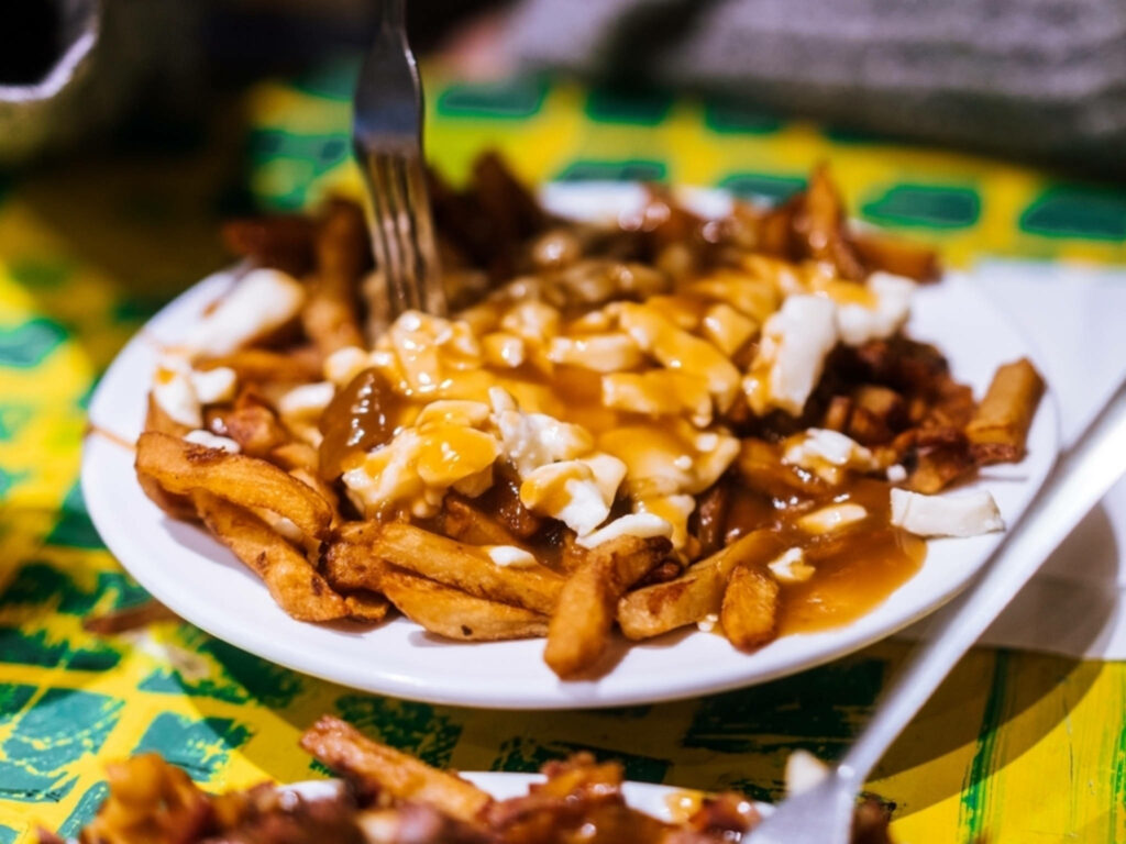 Mouthwatering Poutine: Crispy Fries, Gravy & Cheese Curds Wallpaper