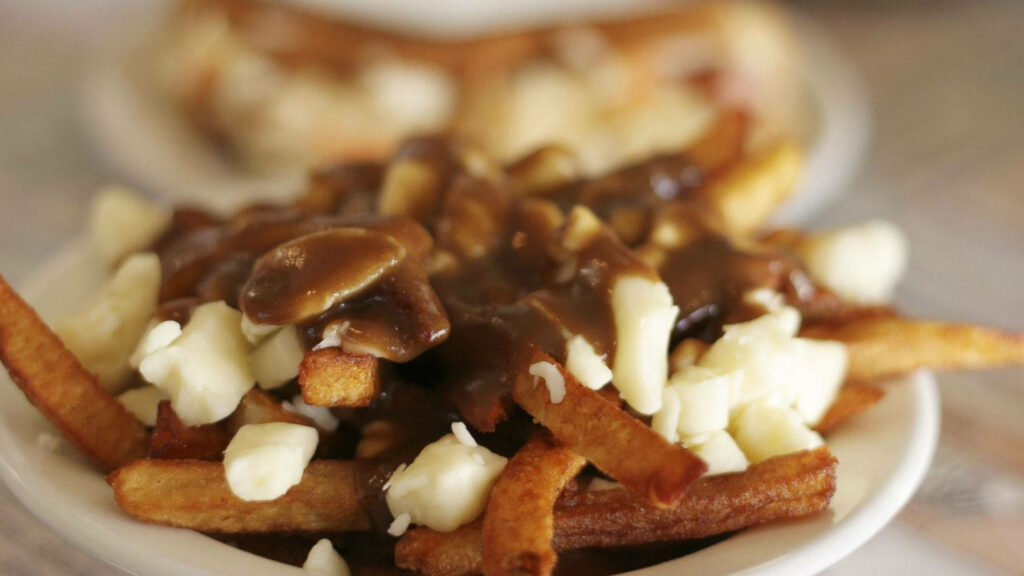 Mouthwatering Poutine Wallpaper: Crispy Fries with Gravy & Cheese Curds