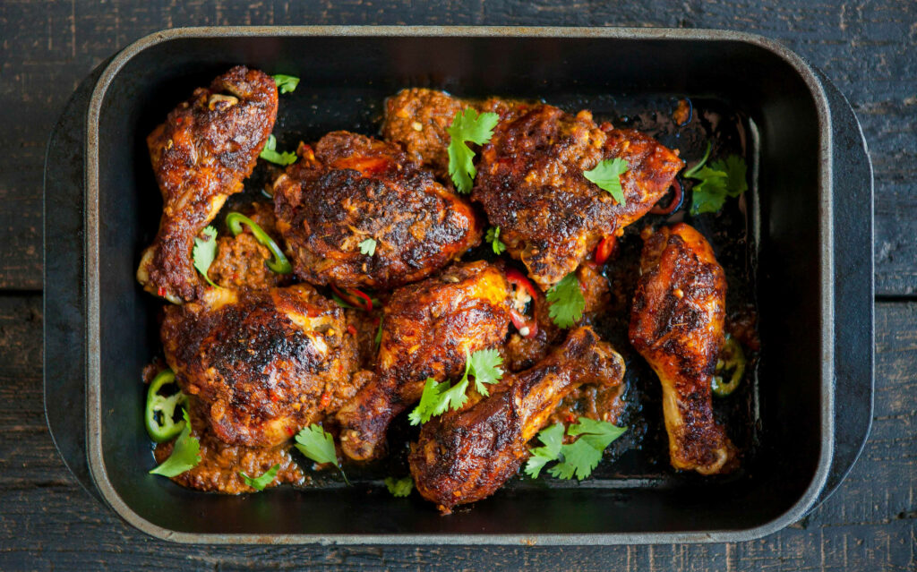 Delicious Roasted Tandoori Chicken Wallpaper with Fresh Cilantro
