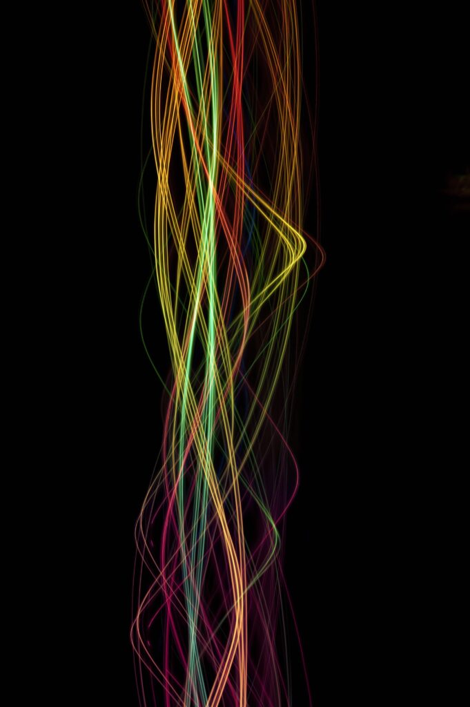 Vibrant Multicolored Glowing Lines Wallpaper - Dynamic Dark Background