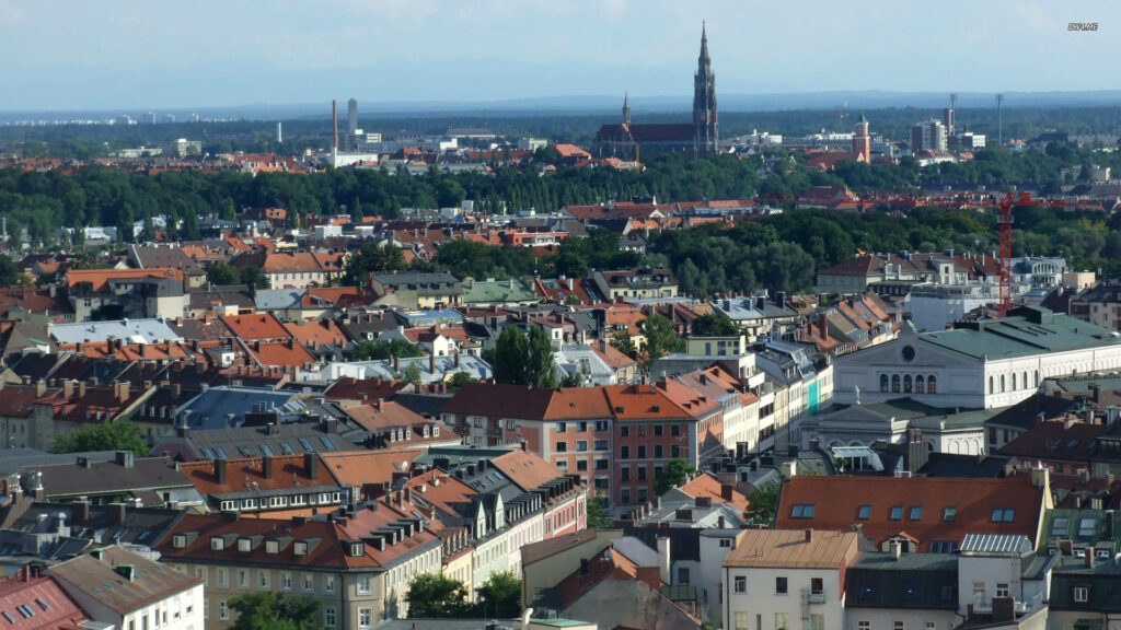 Aerial view of Munich city rooftops historic buildings and iconic skyline vibrant atmosphere wallpaper