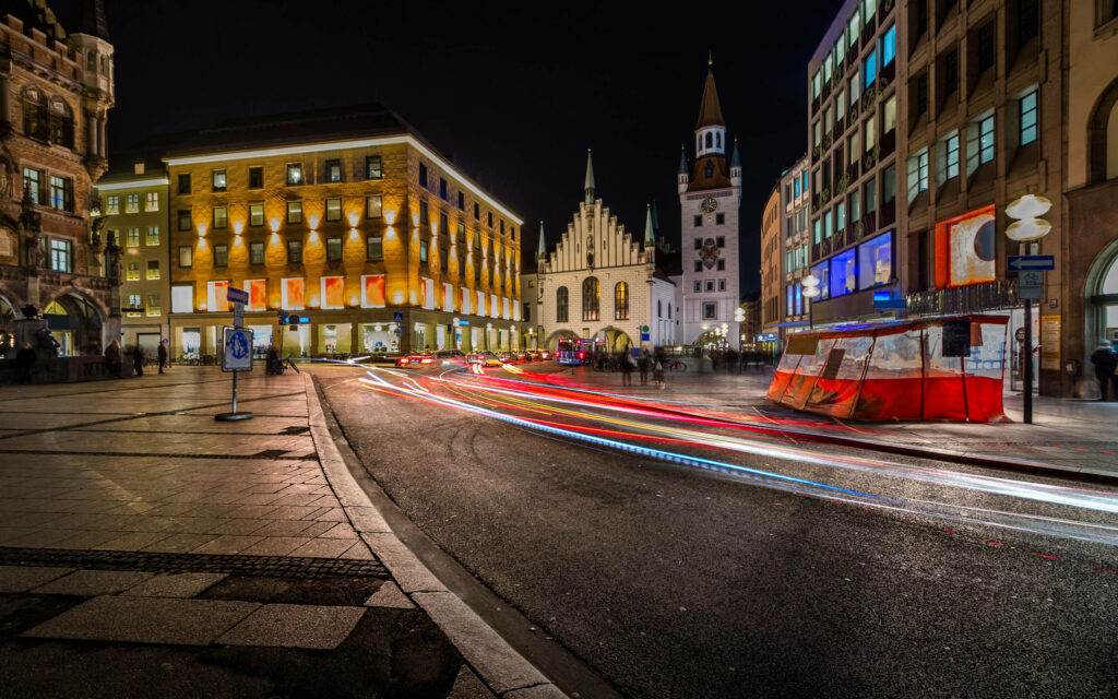 Munich Old Town night scene with historic buildings and colorful light trails urban wallpaper