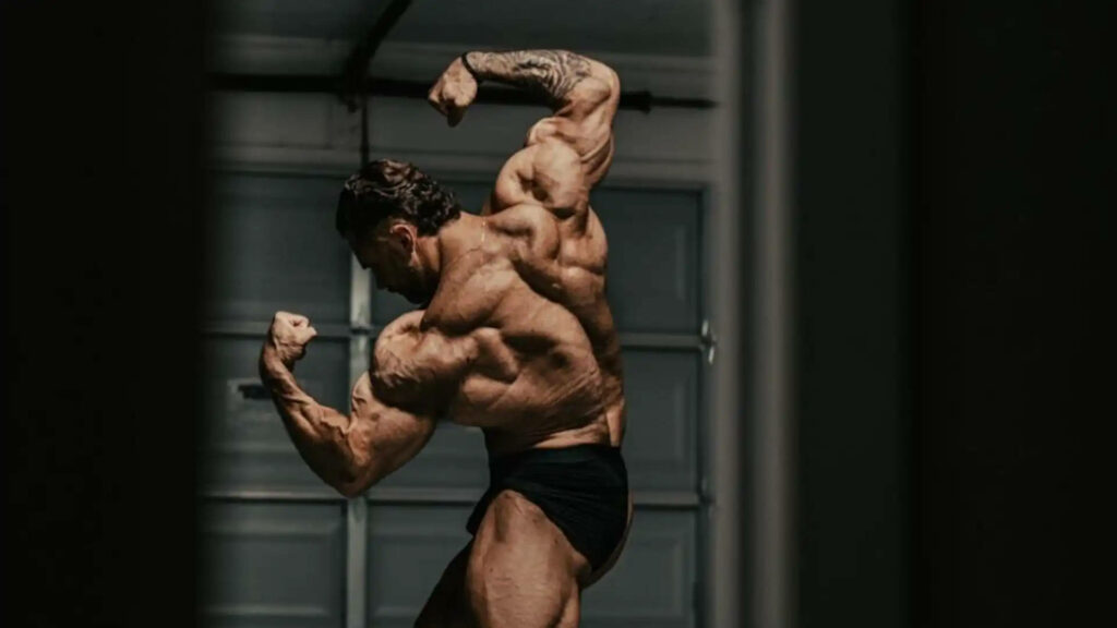 The Stunning Spectacle of Chris Bumstead Showcasing His Chiseled Back Muscles - An Artful Perspective in Photography Wallpaper