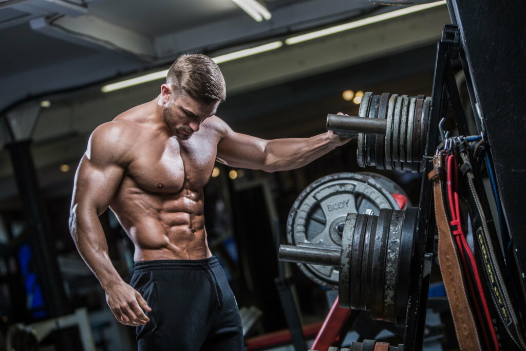 Powering Up with sports: An Epic Display of Muscular Strength Wallpaper