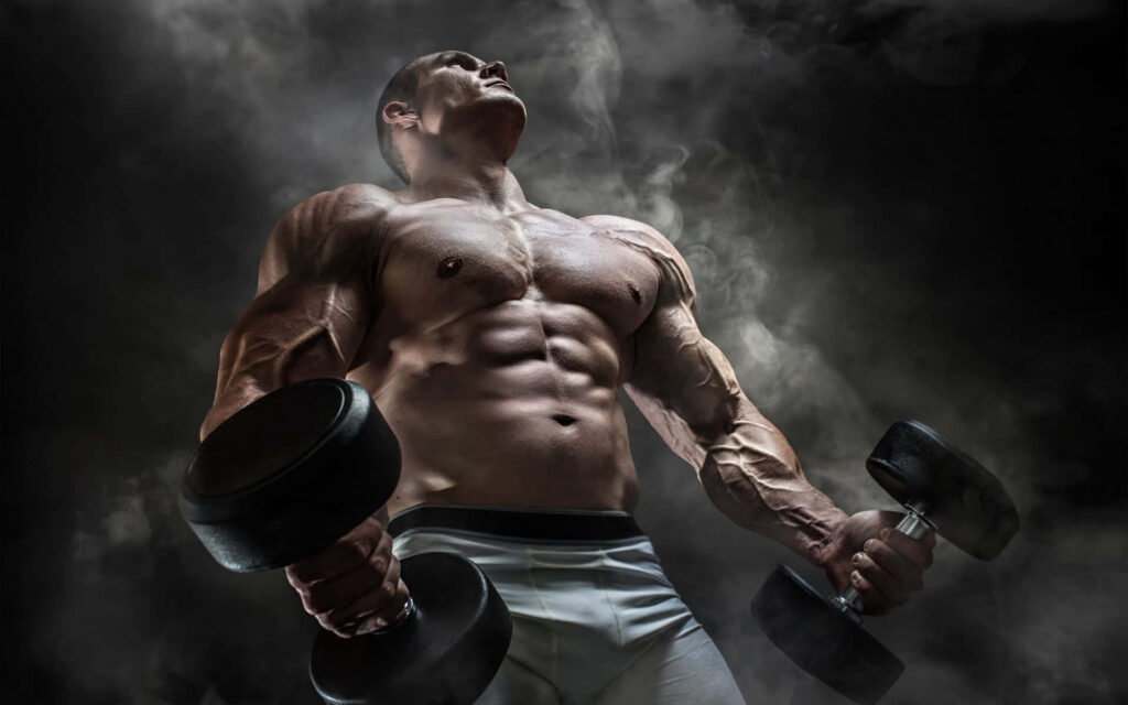 Muscular bodybuilder holding heavy dumbbells under stormy sky with mist and moody lighting Wallpaper