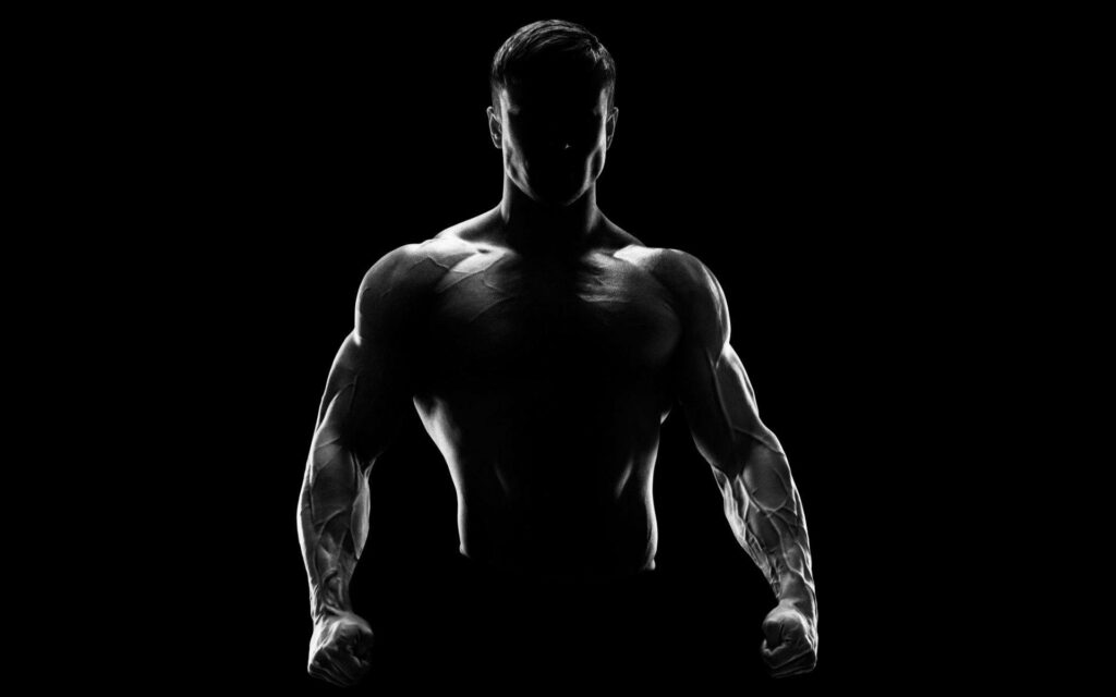 Muscular Fighter Silhouette Wallpaper: Intense Dark Background Art