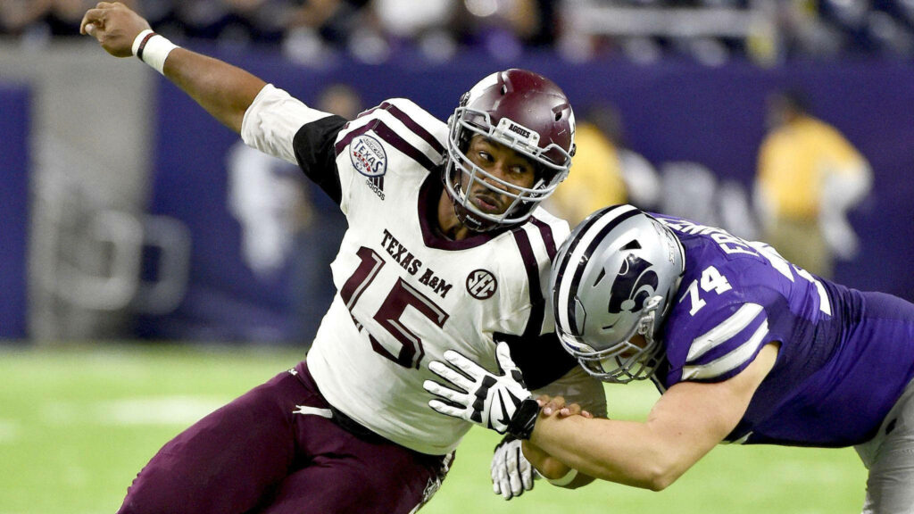 Myles Garrett Texas A&M football blocked by Kansas State player intense action wallpaper background