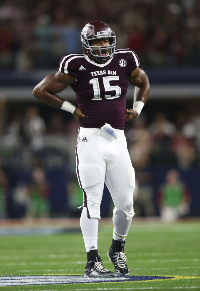 Myles Garrett in Texas A&M uniform on field intense NFL star athleticism wallpaper background