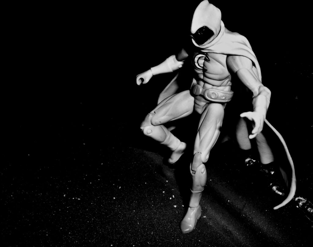 Dynamic Cloaked Figure - Black & White Wallpaper in Dark Atmosphere