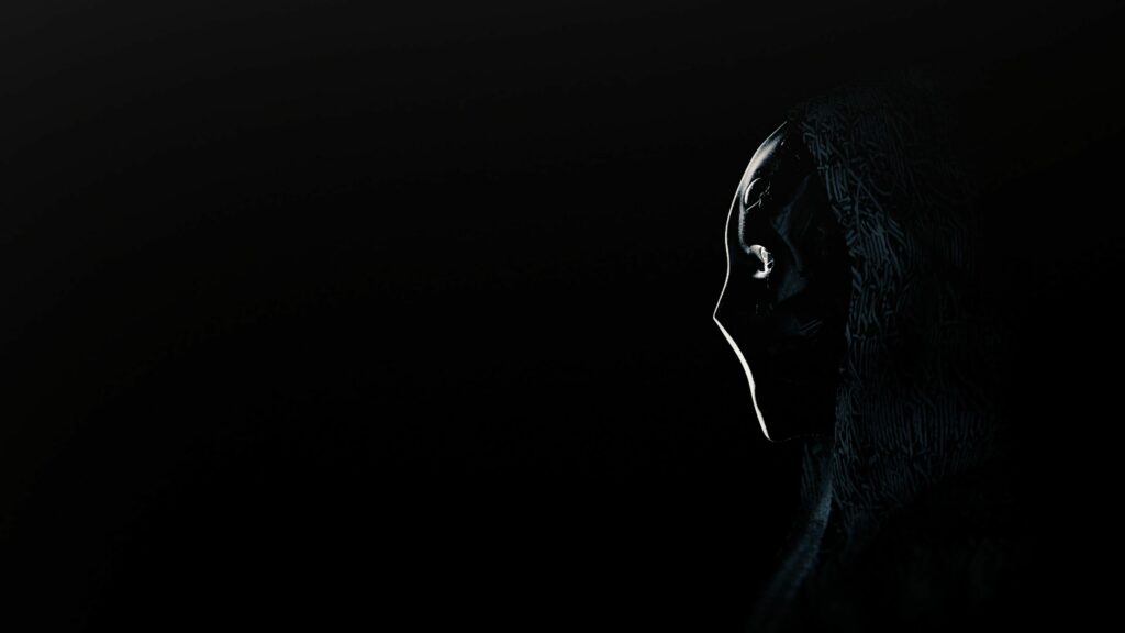 Mysterious Figure in Dark Mask | 3840x2160 Wallpaper Background