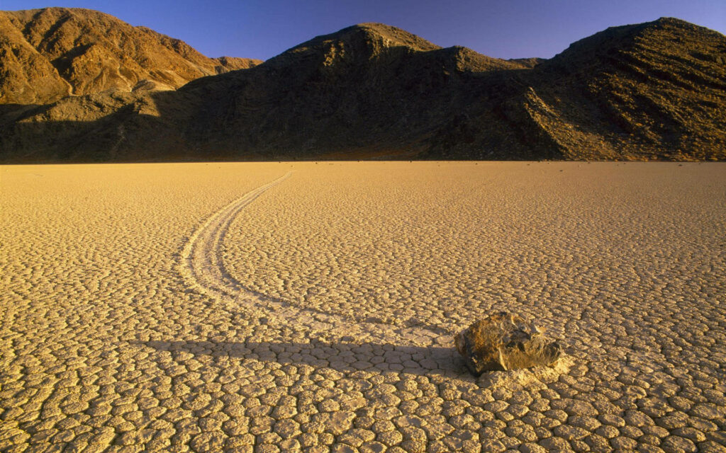 Mysterious Desert Landscape Wallpaper: Rugged Trail & Solitary Rock