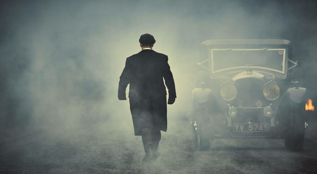 Mysterious Encounter: Tommy Shelby Embracing the Enigmatic Haze- Peaky Blinders 8k Background Snapshot Wallpaper
