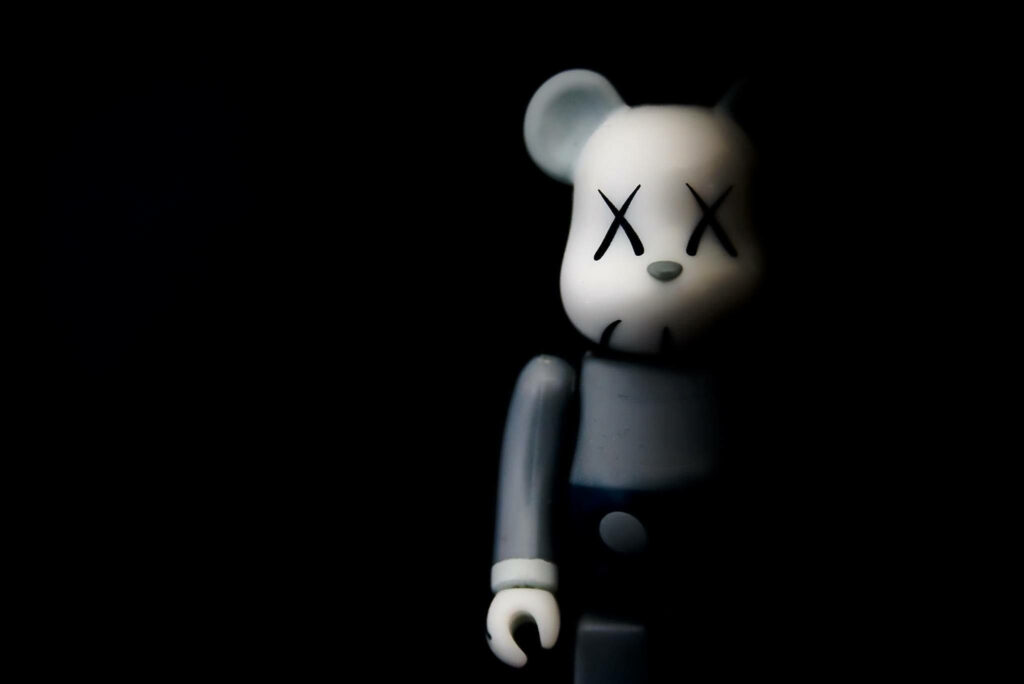 Mysterious Shaded Encounter: Bearbrick Kaws Unveiled in Striking 4K Quality Wallpaper