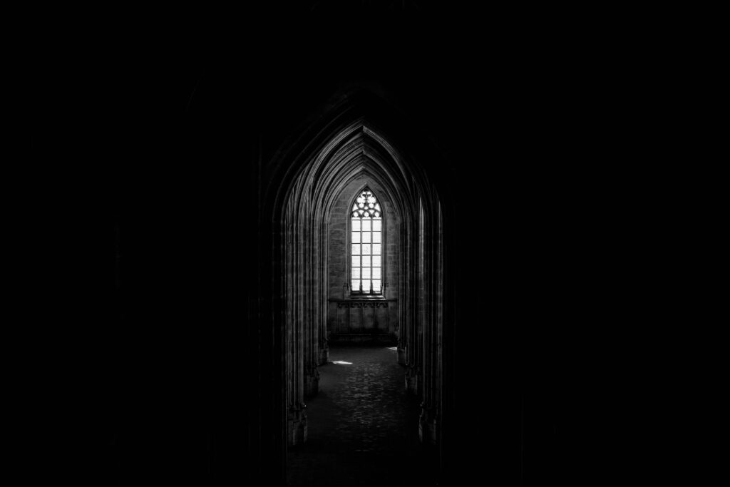 Gothic Dark Corridor Wallpaper with Arched Window Elegance