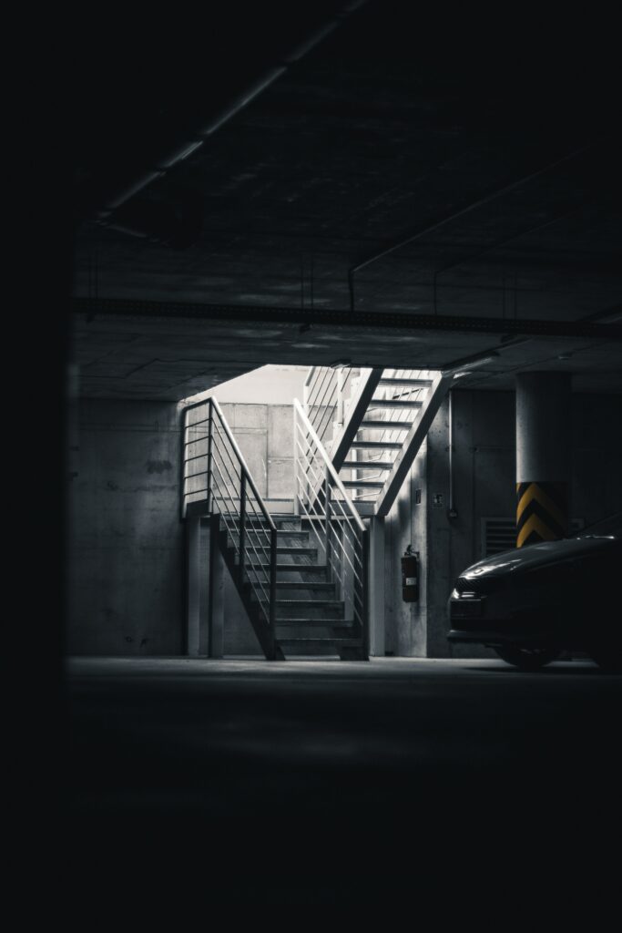 Dark Atmosphere: Gray Car in Underground Garage Wallpaper