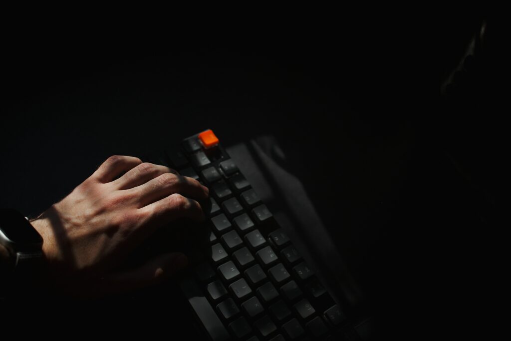 Mysterious Keyboard Wallpaper: Hacker-Inspired Dark Mood Background