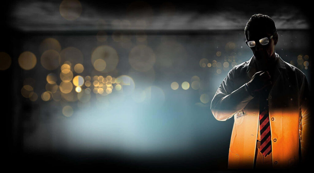 Mysterious Man in Suit: Sophisticated Bokeh Background Wallpaper