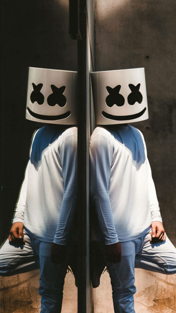 Reflections of the Masked Melody: Marshmello Strikes a Pose in an HD iPhone Wallpaper