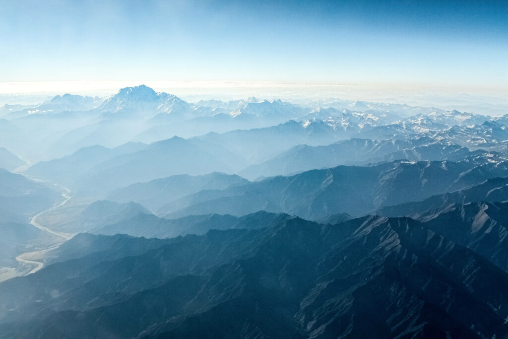 Mysterious Mist Shrouds the Stunning Mountainous Topography Wallpaper