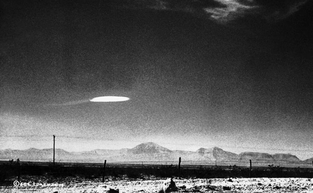 Mysterious UFO Wallpaper: Black & White Desert Landscape