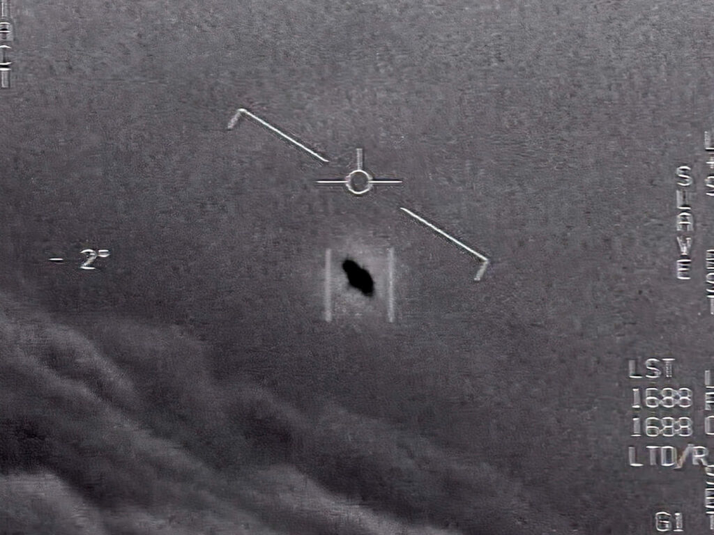 Mysterious UFO Wallpaper: Intriguing Gray Sky Backdrop