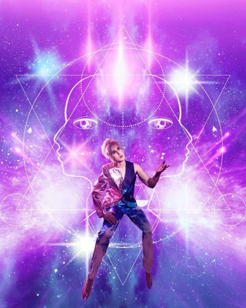 Blonde figure in split-material blazer against vibrant cosmic nebula with glowing geometric outline Wallpaper