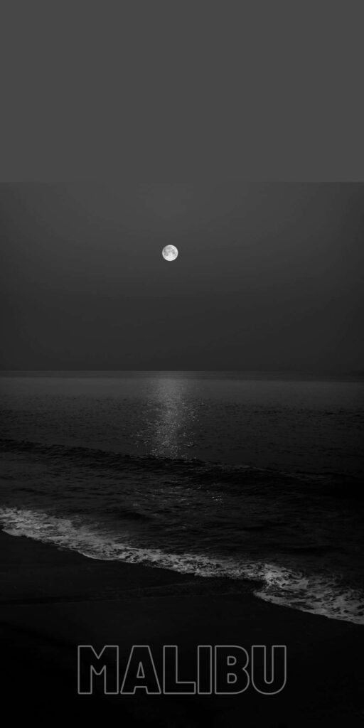 Mystical Evening: An Intriguing Noir Snapshot of Malibu's Enigmatic Shoreline Wallpaper