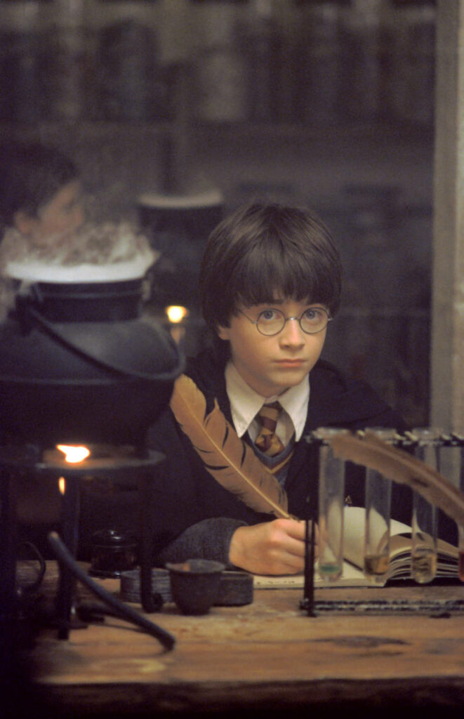Scribing Magic: Harry Potter's Enchanting Potion Study Scene Wallpaper
