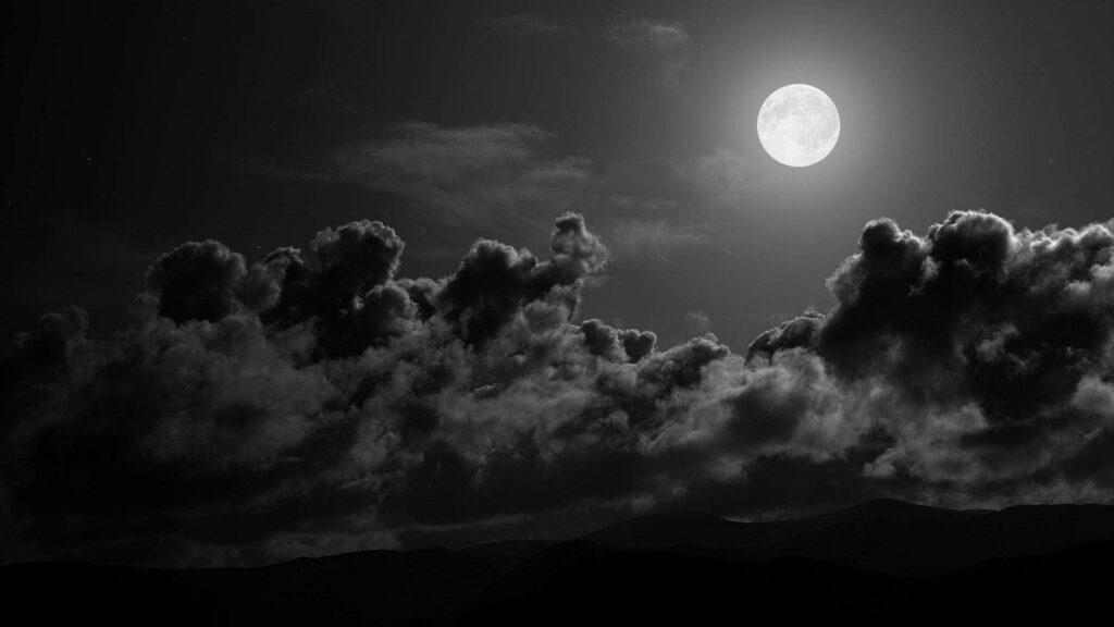 Moody Monochrome: Full Moon Illuminates Dark Cloudscape in High Definition Wallpaper