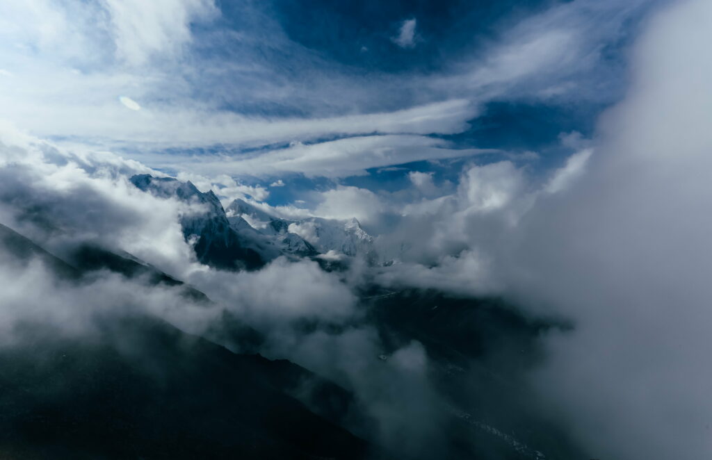Ethereal Mountain Wallpaper: Clouds & Dynamic Sky Background