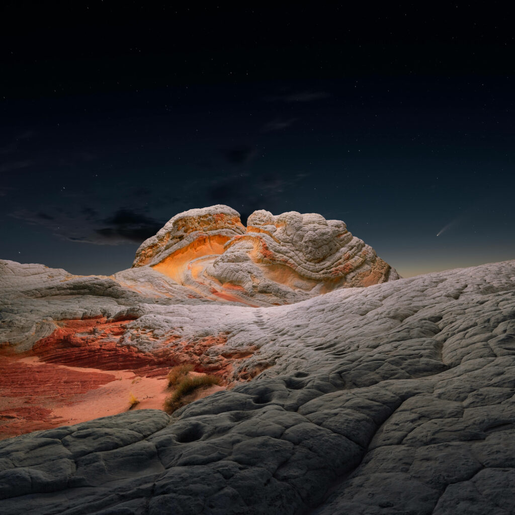 Textured sandstone waves at White Pocket Arizona under a vibrant starry night sky background Wallpaper