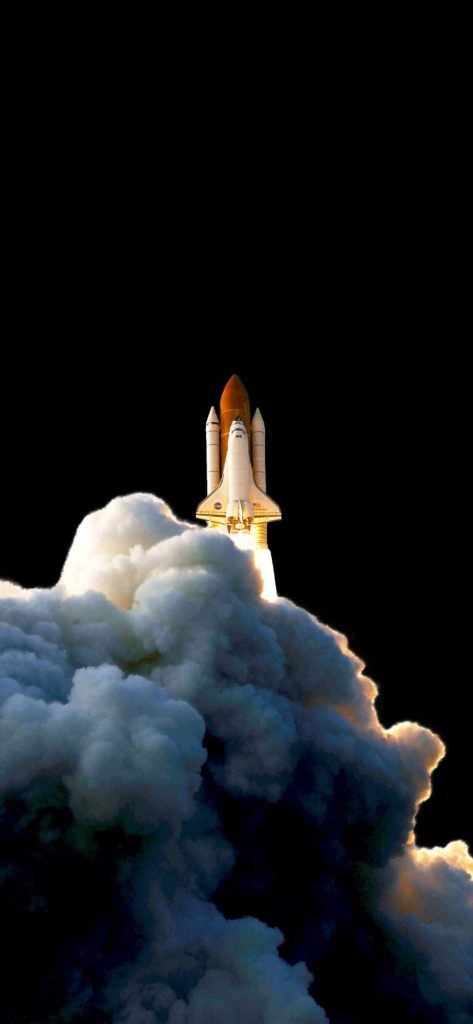 NASA Space Shuttle launching with bright exhaust plume against dark sky cinematic wallpaper