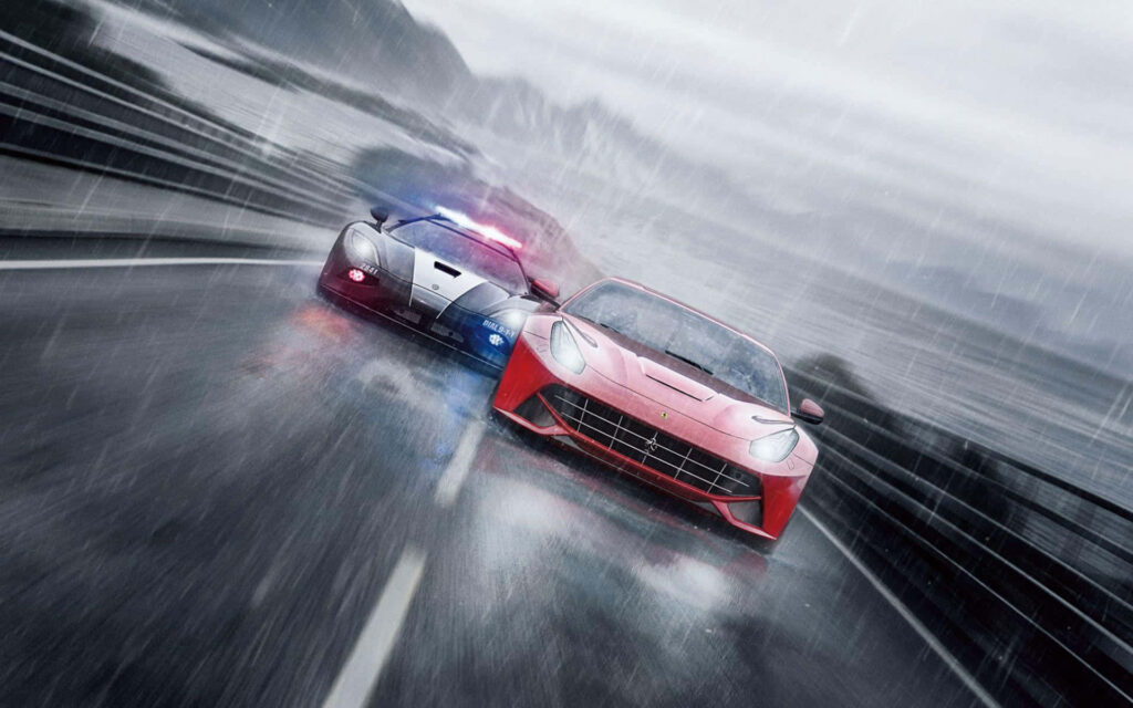 Thrilling rainy police chase in NFS Rivals with red Ferrari and police car on mountain road Wallpaper