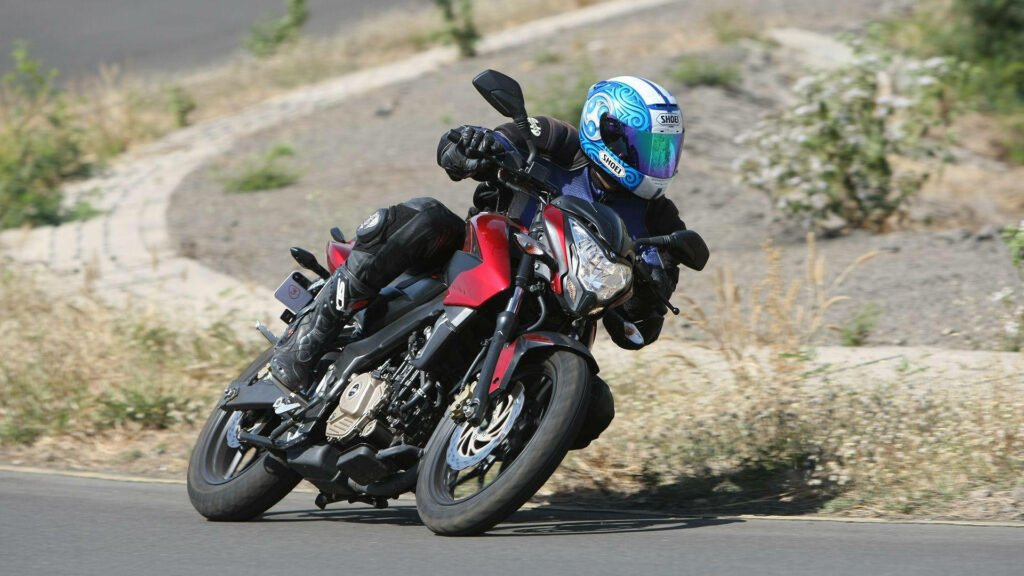 Dynamic NS 200 Motorcycle Rider Wallpaper in Nature