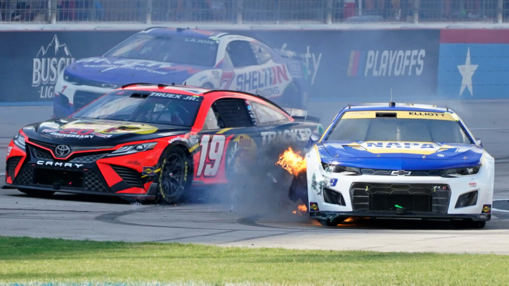 Nascar Cup crash with race cars colliding sparks flames intense motorsport action wallpaper